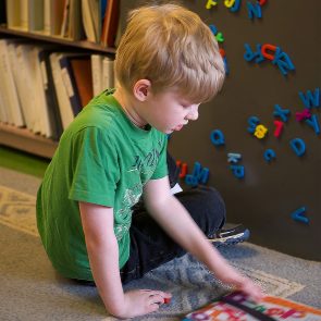 Kid reading on the floor